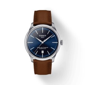 Questa è l'immagine frontale dell'orologio tissot chemin des tourelles powermatic 80 con diametro cassa di 39 mm e di colore blu. l'orologio presenta un cinturino di pelle marrone