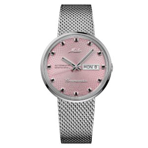 Questa è l'immagine frontale dell'orologio mido commander 1959 con quadrante rosa e cassa di mm 37 con movimento automatico